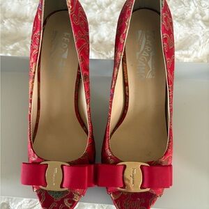 Salvatore Ferragamo Silk Red Heels with Gold Bow. 4 inch heel.
